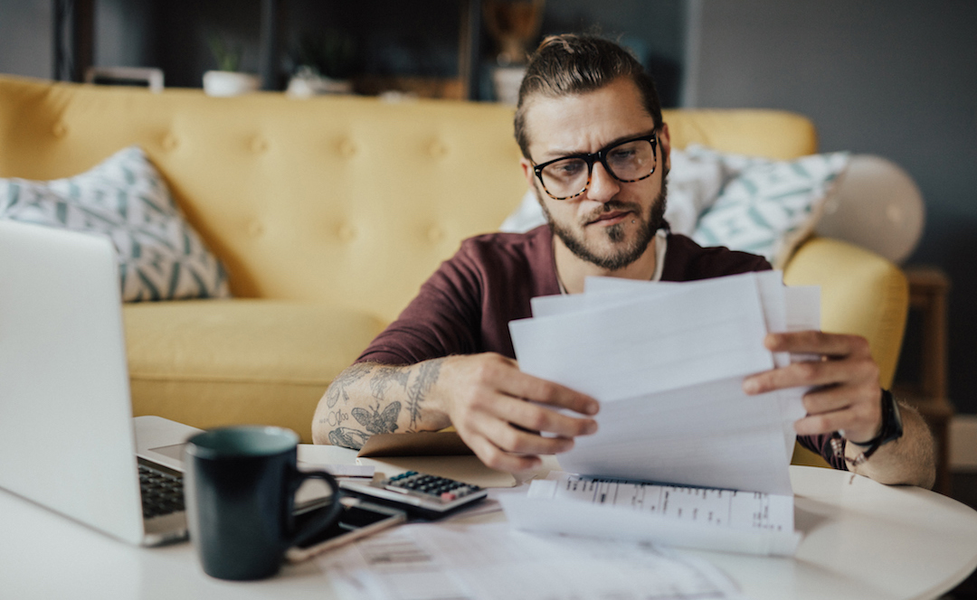 Young man handling household expenses